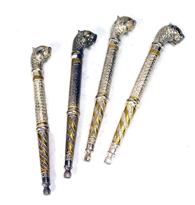 Lot 577 - Four Indian staff heads having lion-head terminals