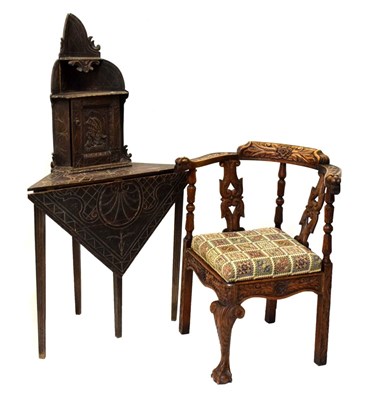 Lot 658 - Late 19th/early 20th Century carved oak corner chair and similar corner table with cupboard over