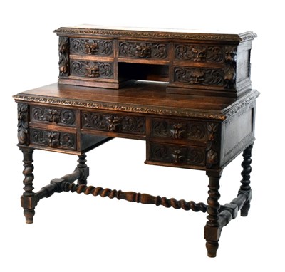 Lot 699 - Edwardian carved oak desk with superstructure