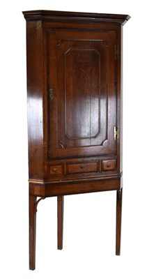 Lot 466 - Cross banded oak corner cupboard on stand