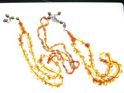 Lot 56 - Clear Amber Beads x 3