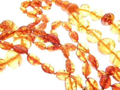 Lot 56 - Clear Amber Beads x 3