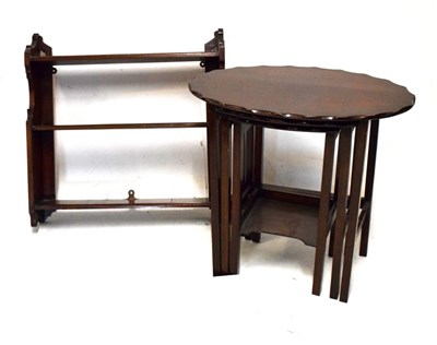 Lot 530 - Mid 20th Century nest of three tables and a mahogany wall shelf