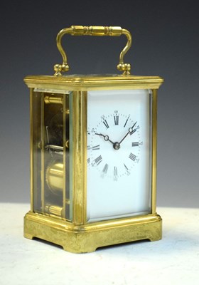 Lot 443 - Brass carriage clock, having a white Roman dial with moon hands