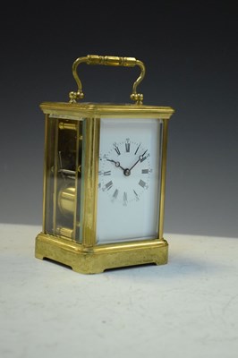 Lot 443 - Brass carriage clock, having a white Roman dial with moon hands
