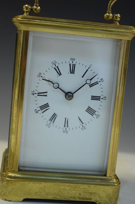 Lot 443 - Brass carriage clock, having a white Roman dial with moon hands