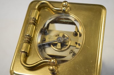Lot 443 - Brass carriage clock, having a white Roman dial with moon hands
