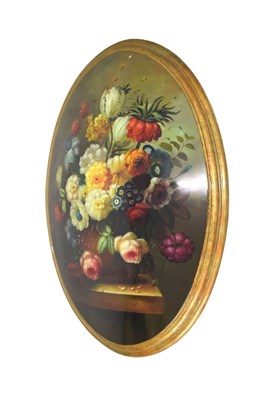 Lot 476 - Oval convex picture of a still life of flowers