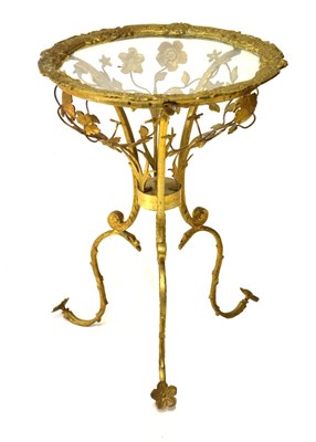 Lot 679 - Circa 1900s French-style cast brass glass top circular occasional table