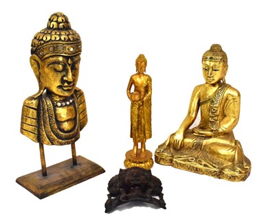 Lot 548 - Three Eastern Buddha figures/busts