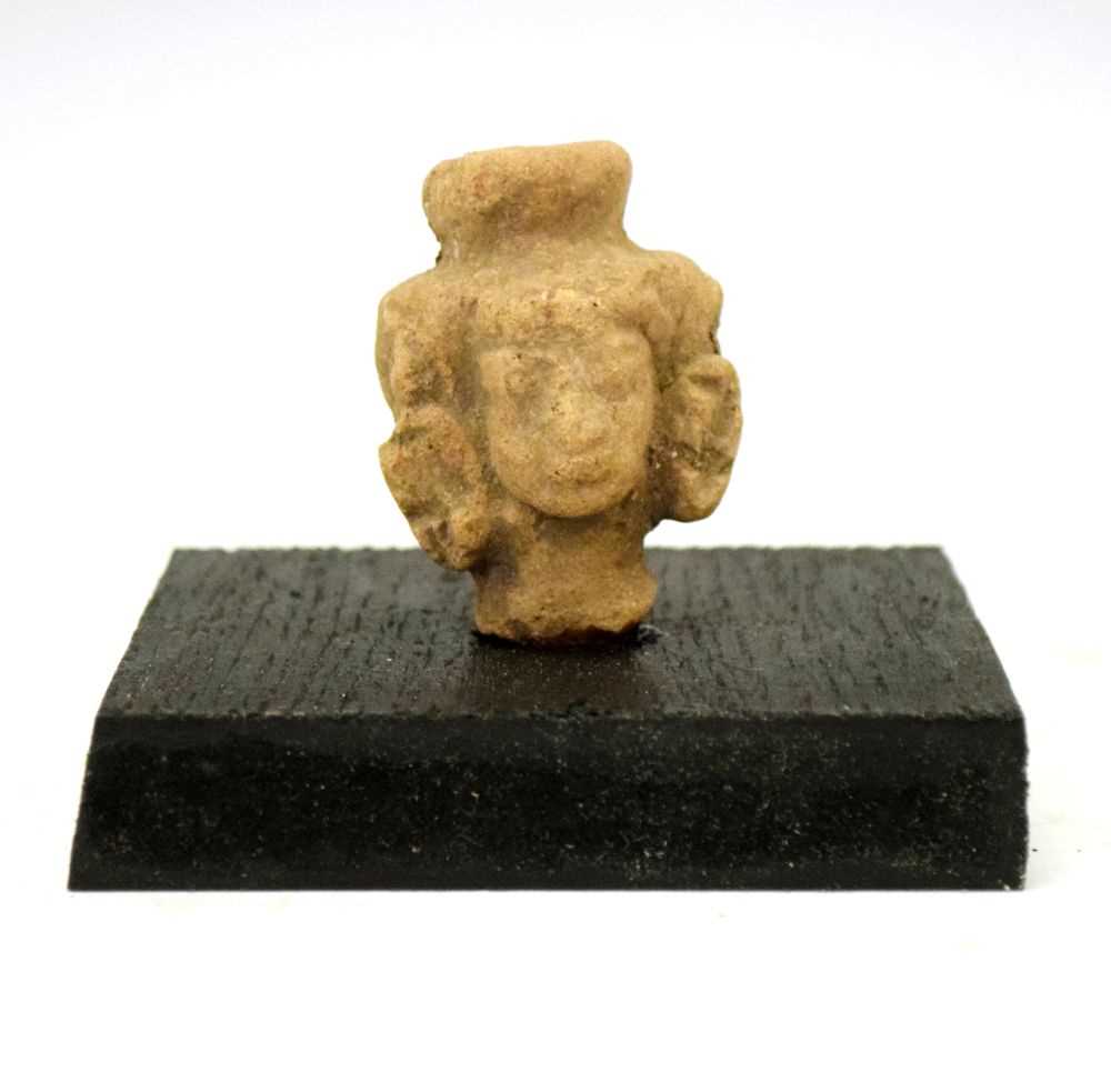 Lot 176 - Small 14th Century Javanese three-headed bust