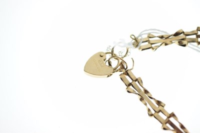 Lot 70 - Small yellow metal bracelet and padlock