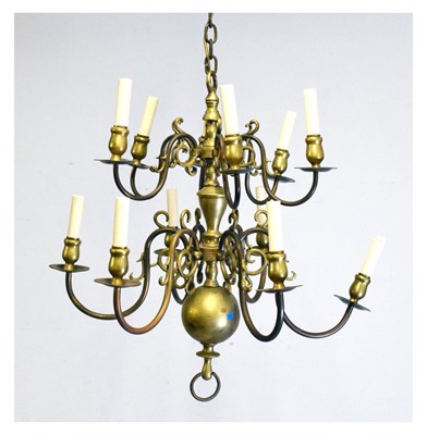 Lot 589 - Two tier brass chandelier having twelve branches