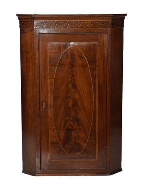 Lot 569 - Large George III mahogany hanging corner cupboard