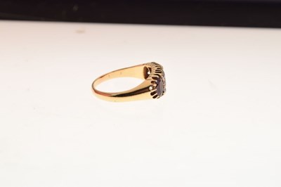 Lot 26 - George V 18ct gold three stone garnet ring