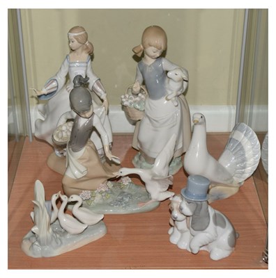 Lot 287 - Three Lladro figures, together with two Nao groups, and other
