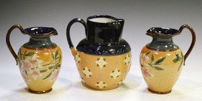 Lot 416 - Pair of Doulton Lambeth stoneware jugs, together with a single