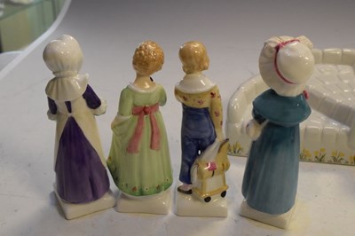 Lot 285 - Royal Doulton 'Kate Greenaway' collection stand and figures