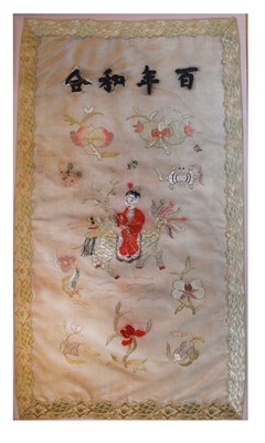 Lot 597 - Chinese silk panel depicting a figure riding a lion dog