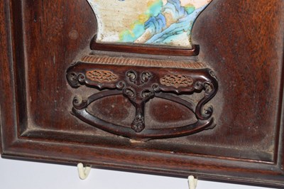 Lot 241 - Chinese hardwood and painted enamel relief panel