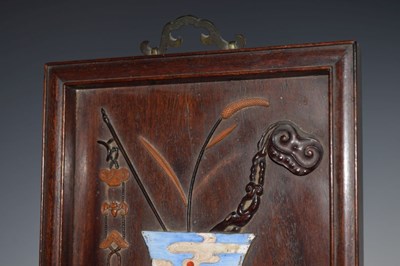 Lot 241 - Chinese hardwood and painted enamel relief panel