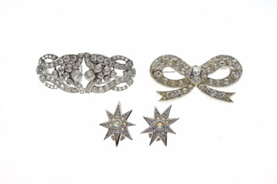 Lot 95 - Pair of Christian Dior ear clips, clip brooch, and a ribbon brooch