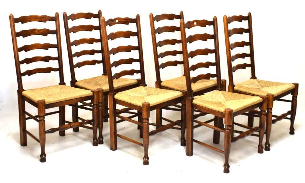 Lot 661 - Good quality rustic dining suite comprising table and six ladderback chairs