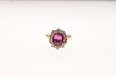 Lot 22 - 18ct gold ruby and diamond cluster ring