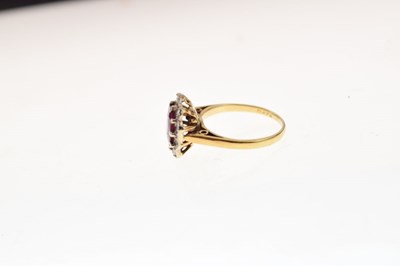 Lot 22 - 18ct gold ruby and diamond cluster ring