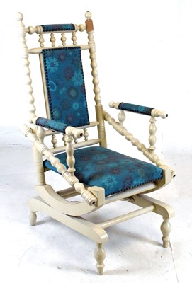 Lot 454 - American rocking chair, upholstered in turquoise floral fabric