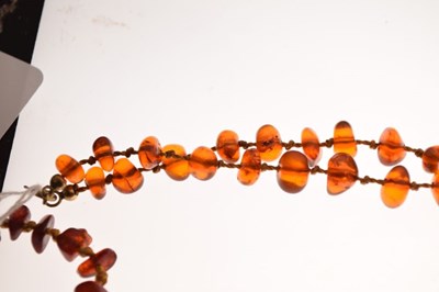 Lot 43 - Two amber bead necklaces