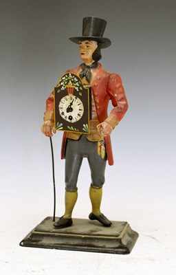 Lot 337 - Painted metal figural 'pedlar' clock