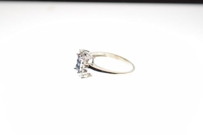 Lot 3 - '14k' white gold cluster ring set six square cut sapphires and fourteen diamonds, 3.6 g gross approx