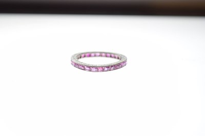 Lot 23 - Unmarked white metal and ruby eternity ring