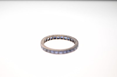 Lot 31 - Unmarked white metal and sapphire eternity ring