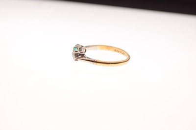 Lot 5 - '18ct Plat' three-stone ring, diamond and emerald