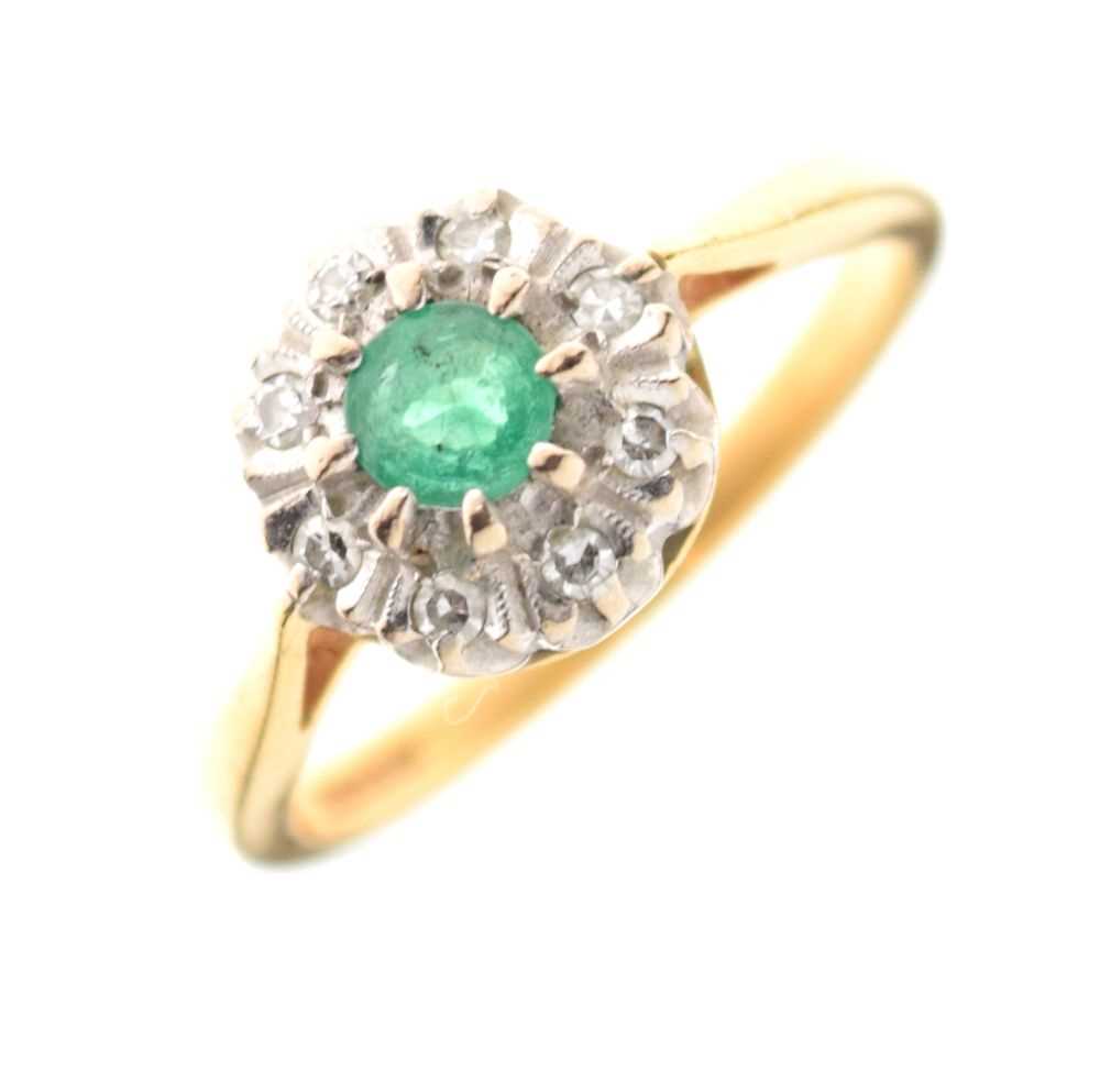 Lot 27 - 18ct gold, emerald and diamond cluster ring
