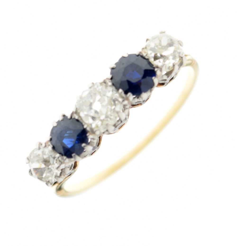 Lot 38 - Unmarked yellow metal, diamond and sapphire five-stone eternity ring