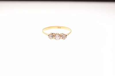 Lot 4 - '18c' yellow metal three-stone diamond ring