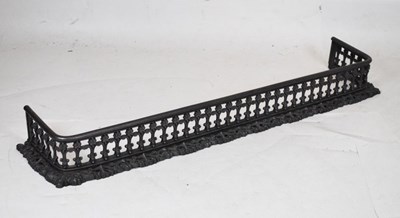 Lot 641 - Cast iron fender with pierced decoration