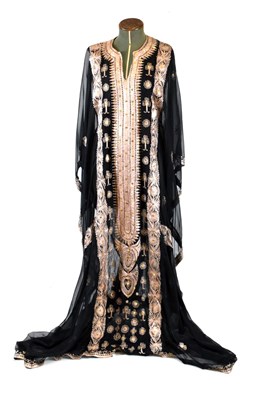 Lot 534 - Omani black semi-sheer dress/robe with typical gold decoration