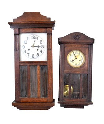 Lot 383 - Two 1920s oak wall clock