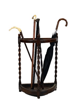 Lot 648 - Demi-lune stickstand and sticks