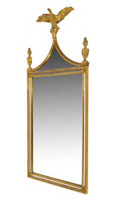 Lot 700 - Reproduction gilt framed mirror topped with an eagle