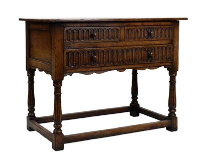 Lot 628 - 20th Century Jacobean style carved oak side table fitted three drawers