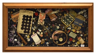 Lot 616 - Framed and glazed button and needlework tools arrangement