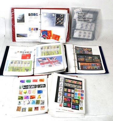 Lot 171 - Four albums of Queen Elizabeth II GB postage stamps, etc