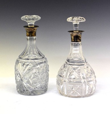 Lot 186 - Two silver collared cut glass decanters