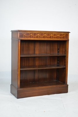 Lot 771 - Brights of Nettlebed reproduction inlaid mahogany low open bookcase
