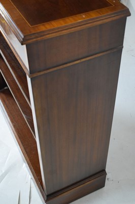Lot 771 - Brights of Nettlebed reproduction inlaid mahogany low open bookcase